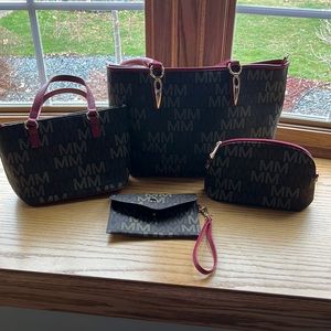 Set of four purses large one gently used for a month small one new
